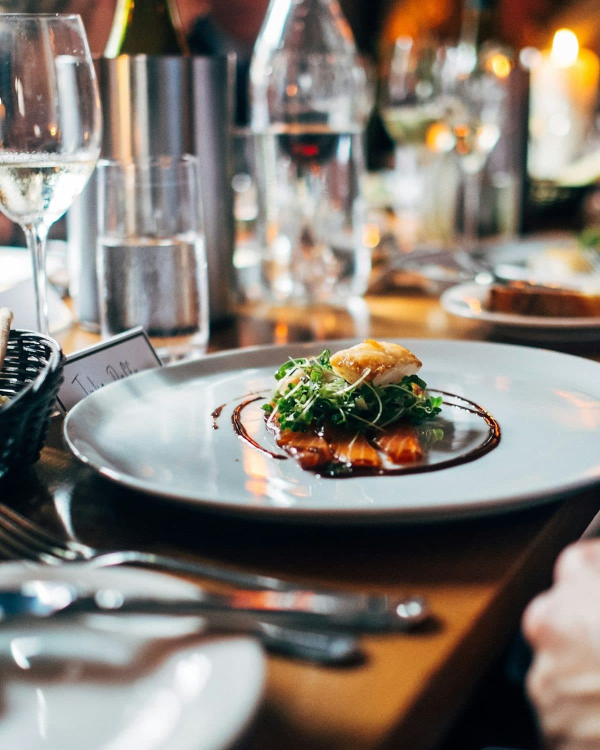 A private chef plating in a home kitchen