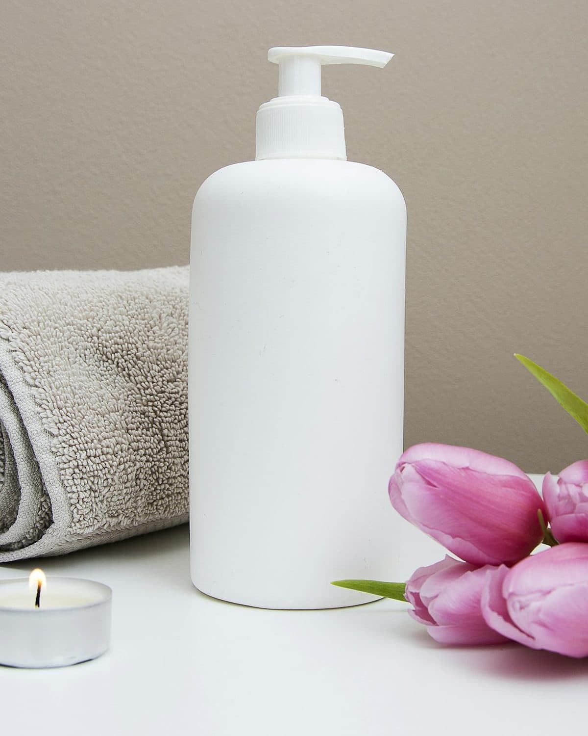 A calm treatment room with folded towels